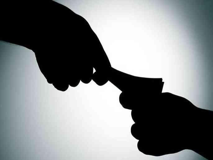 Two employees of the land records office were caught red-handed taking bribe