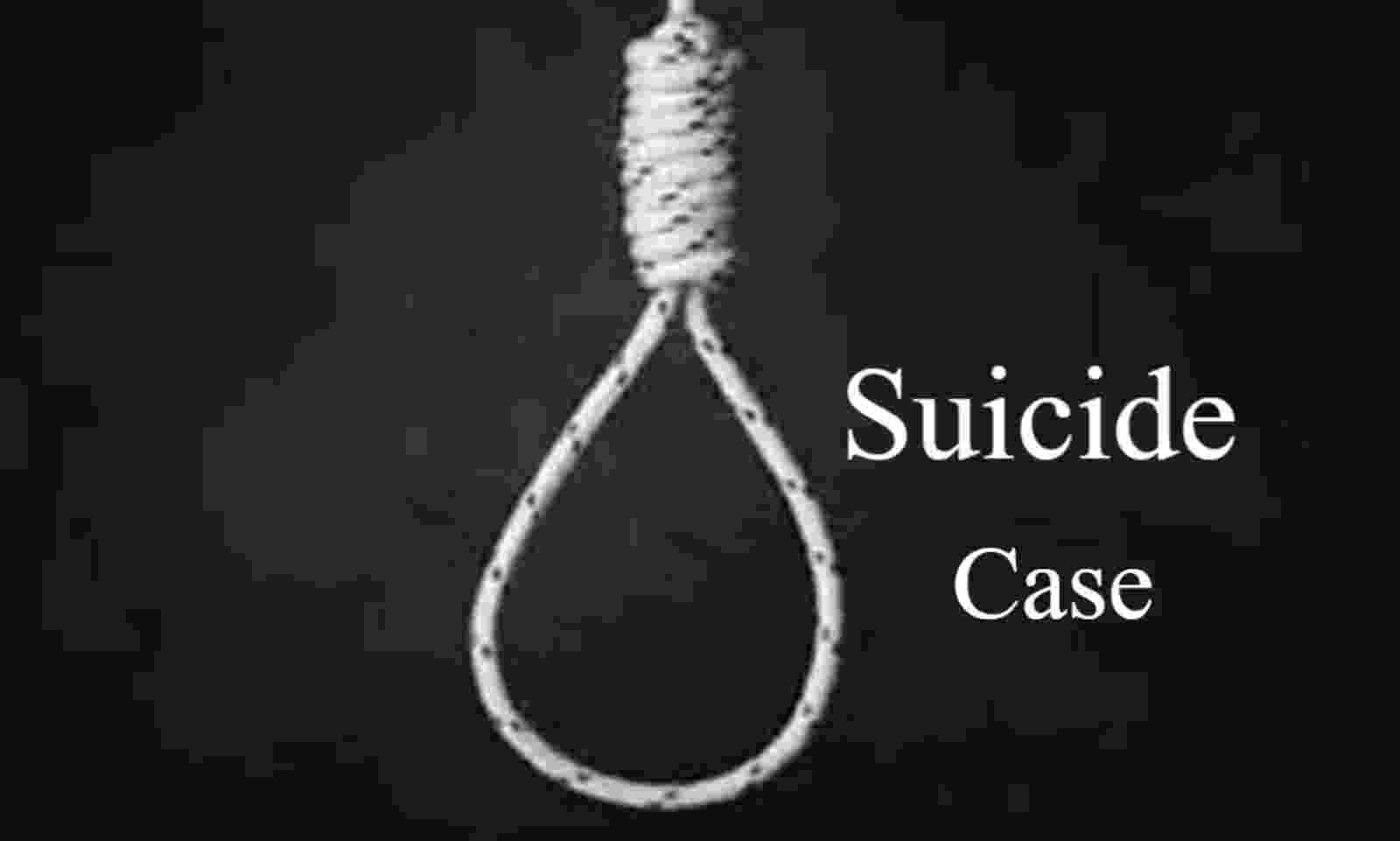 young man committed suicide by hanging himself from a tree in the field