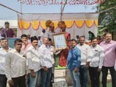 Principal of the school, Bhagwat Sir, was presented with a certificate