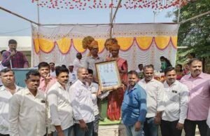 Principal of the school, Bhagwat Sir, was presented with a certificate