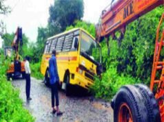 School bus in pit Twenty students survived